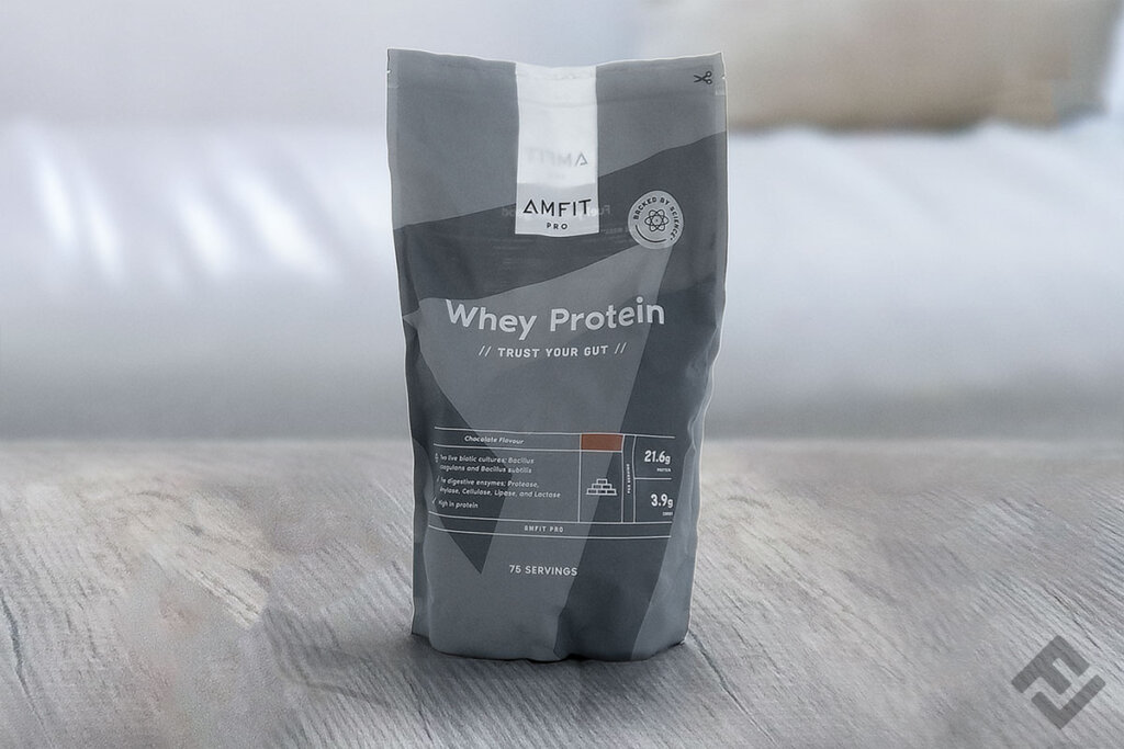 Bag of Amfit Whey Protein powder chocolate on a table